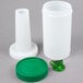 A white plastic container with a green spout and cap.