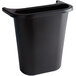 A black Rubbermaid plastic wastebasket with a handle.