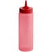 A pink plastic Vollrath Color-Mate squeeze bottle with a red lid.