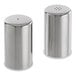 A close-up of two brushed stainless steel salt and pepper shakers.