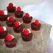 A GET Stone-Mel melamine display tray with chocolate cupcakes and raspberries.