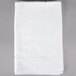 A white Oxford Belleeza bath mat with a white border on a gray surface.