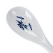 A white melamine rice ladle with a blue water lily design on it.
