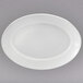 A white oval plate with a white rim.