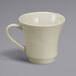 A Oneida cream white china cup with a handle.