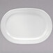 A white oval platter with a curved edge.
