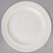 A Oneida Espree cream white china plate with a white rim.