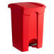 A red Lavex rectangular step-on trash can with a lid.