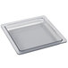 A clear square plastic cooling plate with a lid on a counter.
