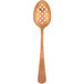 A close-up of a Mercer Culinary rose gold perforated bowl plating spoon.