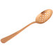A rose gold spoon with a perforated bowl.