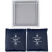 A white square Frilich cooling plate with black trim holding two blue bags with white text.