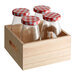 Acopa glass milk bottles with red and white checkered lids in a wooden crate.