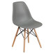 A gray Flash Furniture Elon Series plastic chair with wood legs.