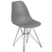 A gray plastic chair with metal legs.