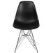 A Flash Furniture black plastic accent chair with metal legs.