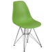A green Flash Furniture plastic chair with metal legs.