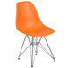 An orange Flash Furniture plastic restaurant chair with metal legs.