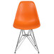 An orange Flash Furniture plastic accent chair with metal legs.