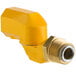 A yellow plastic pipe with a brass nut on a Regency Gas Hose.