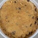 A white bowl of David's Cookies chocolate chunk cookie dough with chocolate chips.