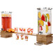 A wooden bar with two Rosseto bamboo drink dispensers filled with fruit and drinks.