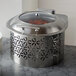 A Rosseto stainless steel chafer warmer with a lid on a marble counter.