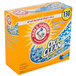 An Arm & Hammer Fresh Scent Powder Laundry Detergent Plus OxiClean box on a kitchen counter.
