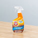 A bottle of Arm & Hammer 32 oz. Hard Surface Cleaner on a table.