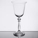 A clear Libbey wine glass with a long stem.