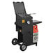 A large black R & V Works outdoor fryer with a stand.