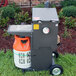An R & V Works Cajun deep fryer with a white and orange propane cylinder on a stand.