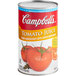 A 46 fl. oz. can of Campbell's Tomato Juice with a white label.