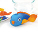 A blue and orange fish made out of Crayola air-dry clay.