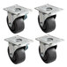 A set of 4 black rubber plate casters with steel plates.