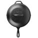 A black Lodge cast iron skillet with a white background.