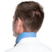 The back of a man wearing a light blue Intedge chef neckerchief.