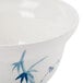 A close-up of a Thunder Group Blue Bamboo melamine noodle bowl with a blue bamboo plant design.