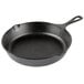 A black Lodge cast iron skillet with a cover.