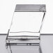A clear glass cube filled with clear ice sitting on a table.