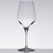A Stolzle Chardonnay wine glass on a table.