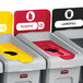 A red Rubbermaid Slim Jim recycling container with a grey lid and a recycle symbol on the side.