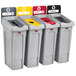 A group of Rubbermaid Slim Jim recycling bins with different colored lids.