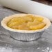 A pie in a Durable Packaging tart pan on a counter.