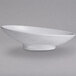 A close-up of a G.E.T. Enterprises marble white oval bowl with speckles.
