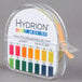 A Hydrion pH test paper dispenser with a label on it.