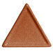 A close up of a brown triangle with a textured finish.