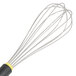 A Matfer Bourgeat stainless steel whisk with an Exoglass handle with yellow and black accents.