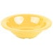 A tropical yellow melamine bowl with a white interior.