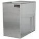 A silver stainless steel Cornelius water cooled ice maker with a black label.